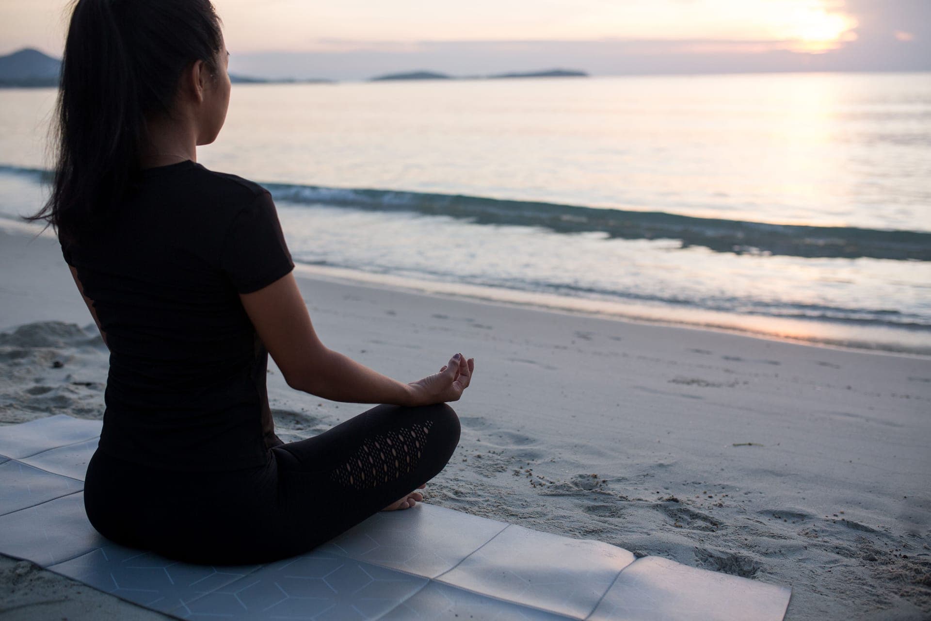 Yoga by the sea at sunset in Koh Samui